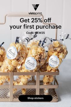 several bags of popcorn sitting on top of a wooden crate with the words stick on a little personal touch