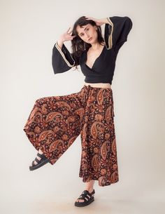 Introducing palazzo pants Veda. Made from pure cotton, this skirt pants is lightweight and breathable.  The classy touch of the handblock print adds a unique flair to any outfit. Features: - One size - Best fit S/M - Made from pure cotton - Artisanal print technique with handblock - Shells buttons - Crafted with care for long-lasting durability - Sustainable materials and dyeing processes Care Instructions: Machine washable on gentle cycle with cold water. Hang or lay flat to dry. Cotton Wide-leg Pants With Boho Print, Cotton Wide Leg Pants With Boho Print, Hippie Cotton Long Skirt, Traditional Block Print Bottoms For Summer, Boho Print Wide Leg Cotton Bottoms, Wide Leg Cotton Bottoms With Boho Print, Wide Leg Boho Print Cotton Bottoms, Bohemian Long Skirt With Paisley Print, Wide Leg Cotton Bottoms With Paisley Print