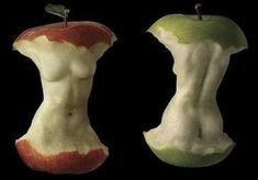 an apple that has been cut in half to look like a woman's torso