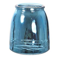 a blue glass candle holder on a white background