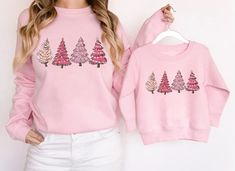 "Mommy and Me Christmas Sweatshirt, Pink Christmas Sweaters, Matching Mom and Me Christmas, Matching Christmas Shirt, Christmas Outfit **PLEASE NOTE: THIS IS NOT A SET - SWEATSHIRTS MUST BE PURCHASED SEPARATELY IN ORDER TO RECEIVE BOTH MAMA AND MINI SWEATSHIRTS. IF YOU HAVE ANY QUESTIONS FEEL FREE TO REACH OUT ANYTIME AND WE WILL BE HAPPY TO ASSIST YOU. H O W T O O R D E R 1. Simply select the size of your hoodie individually and then click \"Add to Cart\" 2. Repeat each step for each hoodie tha Christmas Picture Outfits, Pink And Red Christmas, Mommy And Me Christmas, Christmas Attire, Matching Christmas Shirts, Outfits Mom, Christmas Picture, Mommy And Me Shirt, Christmas Matching