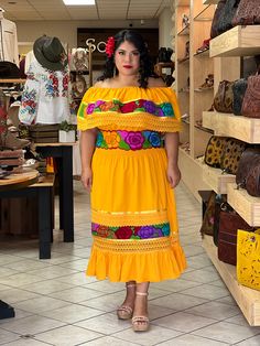 This Beautiful Off the Shoulder Mexican Dress has lace details throughout the dress. It's comfortable with elastic around the shoulder and waist and made out of cotton. The flowers are embroidered by Mexican Artisans on Artisanal Machine. Please note: You have the option of purchasing the dress with one of the two belt options shown for a special price or purchasing the dress on its own. Traditional Mexican Clothing, Mexican Dresses For Women, Charro Theme Party For Boys, Yellow Mexican Dress, Mexican Maternity Dress, Traditional Embroidered Fiesta Dresses, Mexican Dresses Traditional Officialfiesta.com, Mexican Fiesta Dresses, Traditional Sleeveless Embroidered Fiesta Dress