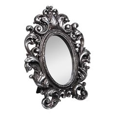 an ornate mirror is shown against a white background