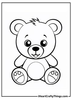 a black and white teddy bear with big eyes