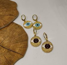 hoop earringsgold hoop earringsdangle earringshuggie hoop earringsclip on earringsgold evil eyeevil eye earringsgold earringsdrop earringsgift for hervintage earringsstatement earringseye earringsGold evil eye hoop earringsThis cute earrings are made from steell and they are 24k gold plated and handpainted.You can choose between 4 different clasps (the numbers 1 and 2 are for non pierced ears)They are very light and comfortable!Plus they are anti allergic/ nickel free ❤Evil eye meaningThe evil e Evil Eye Meaning, Evil Eye Ring Silver, Eye Meaning, Crescent Moon Jewelry, Dangle Earrings Gold, Vintage Clip On Earrings, Evil Eye Earrings, Gold Dangle Earrings, Evil Eye Ring