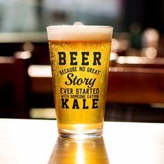 a beer glass sitting on top of a table