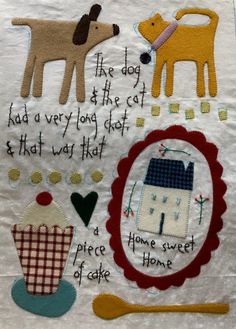 a piece of fabric with dogs on it and some words in the center, along with other things to sew