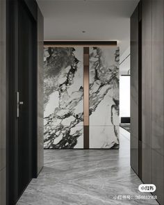 an open door leading to a bathroom with black and white marble on the walls,