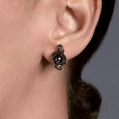 Fancy dark, mysterious fashion? This pair of earrings is for you. The Enchanted Disney Fine Jewelry Black Rhodium over Sterling Silver with 1/5 CTTW Black Diamond and Round Pearl Ursula Earrings will bring depth and drama to your looks. Rock noir with ease by pairing these ear jewels with an all-black ensemble. Be it a casual button-up blouse and black skinnies or your favorite little black dress, these black pearl earrings inspired by Ursula will inject a wicked sense of awesomeness to your sty Diamond Pearl Earrings, Enchanted Disney, Black Pearl Earrings, Enchanted Disney Fine Jewelry, Disney Fine Jewelry, Pearl And Diamond Earrings, Jewelry Black, Black Rhodium, Shop Engagement Rings