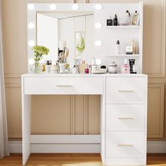 a white vanity with lights on it in front of a wall mounted mirror and shelf