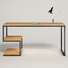 a desk with a lamp, books and a book shelf on the bottom floor next to it