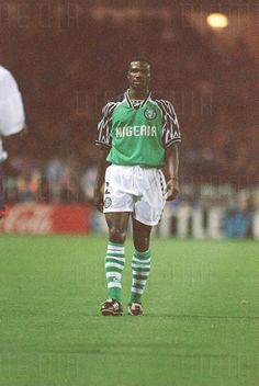 a man standing on top of a soccer field