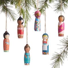 christmas ornaments hanging from a pine tree