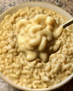 a white bowl filled with macaroni and cheese