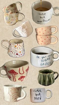 there are many different coffee cups with words written on the mugs and saucers