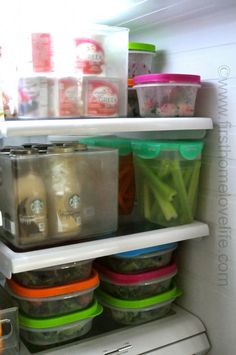 the refrigerator is stocked with various containers and food