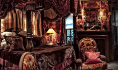 an ornate bedroom with red and gold decor