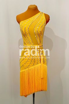 a yellow dress with fringes and beads on it