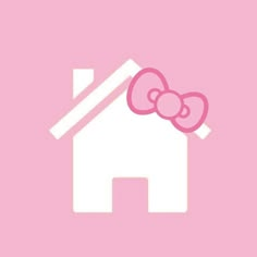 a pink house with a bow on it's roof and the word hello kitty written in white