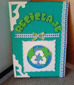 a green and white book with the word recycling on it