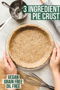 a person holding a pie crust in front of an uncooked pie pan with the title 3 ingredients for a pie crust