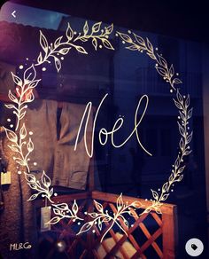 a glass window with the word moll written in cursive writing on it