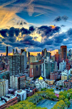 an aerial view of new york city at sunset