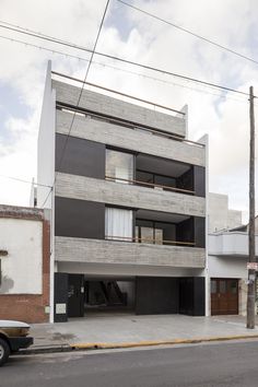 an apartment building on the corner of a street