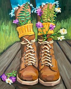 a painting of a pair of boots with flowers on the soles, sitting on a wooden table