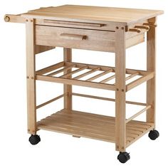 a wooden kitchen cart with drawers on wheels