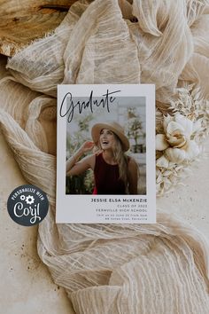 a photo of a woman wearing a hat on top of a blanket with the words graduate