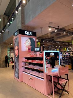 the inside of a cosmetics store with people shopping