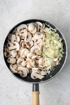 mushrooms and onions cooking in a skillet