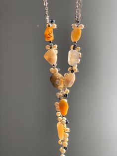 The unique baroque lariat necklace is assembled from semi-precious stones: honey and gray agate, natural vintage pearls and bright dark blue rhinestone beads. This precious lariat will be appropriate for a visit to the theater, a restaurant or for a performance on stage. All photos are taken without special effects, exclusively live. In the only version without the possibility of repetition. Earrings with vintage pearls will go well with this sotoire (necklaces are not included in the price, you can buy them from the link): https://www.etsy.com/listing/1797041269/unique-ukrainian-jewelry-ukrainian?click_key=21f6e6666f5a32e104082d6da5a8ef618a998da9%3A1797041269&click_sum=ad74ae75&ref=shop_home_active_3&sts=1 Check out my other Christmas items https://www.etsy.com/shop/ZhorzhynaWorkshop?ref= Vintage Pearl Jewelry, Ukrainian Jewelry, Evening Necklace, Pearls Jewelry, Rhinestone Bead, Vintage Pearls, Special Effects, Necklace Vintage, Lariat Necklace