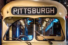 an old yellow bus with the words pittsburg on it's front window