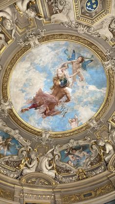 an ornate ceiling with paintings on it