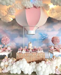 a baby's first birthday party with balloons and teddy bears