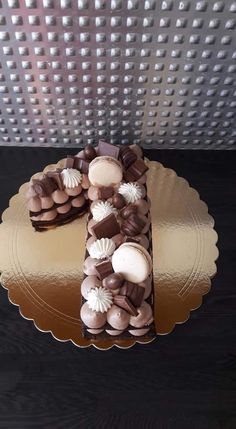 there is a cake decorated with chocolates and seashells on the top of it