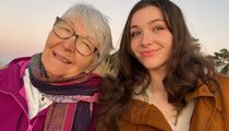 two women standing next to each other smiling