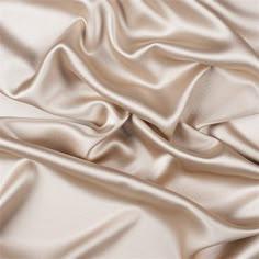 a close up view of a satin fabric with very soft folds and smooth lines on it