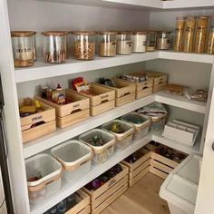 an organized pantry with bins and baskets