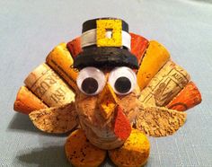 a turkey made out of wine corks with a hat on it's head