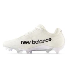 the new balance football shoe in white with black and white lettering on the upper part