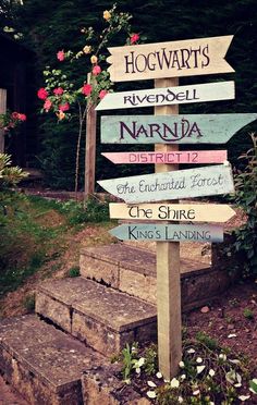 a wooden sign with several different signs on it