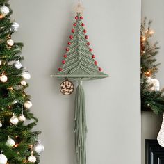 a christmas tree hanging from the side of a wall