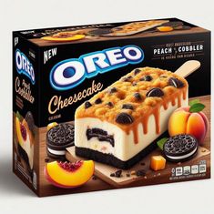 an oreo cheesecake with cookies and peaches on the side, in a box