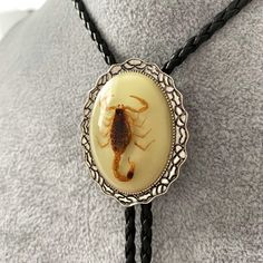 a necklace with a scorpion on it