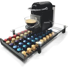 an espresso machine with many cups in it