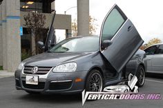 a car with its door open in a parking lot