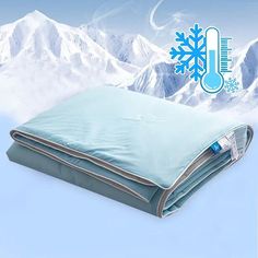 a blanket with a thermometer on it and snowflakes in the background